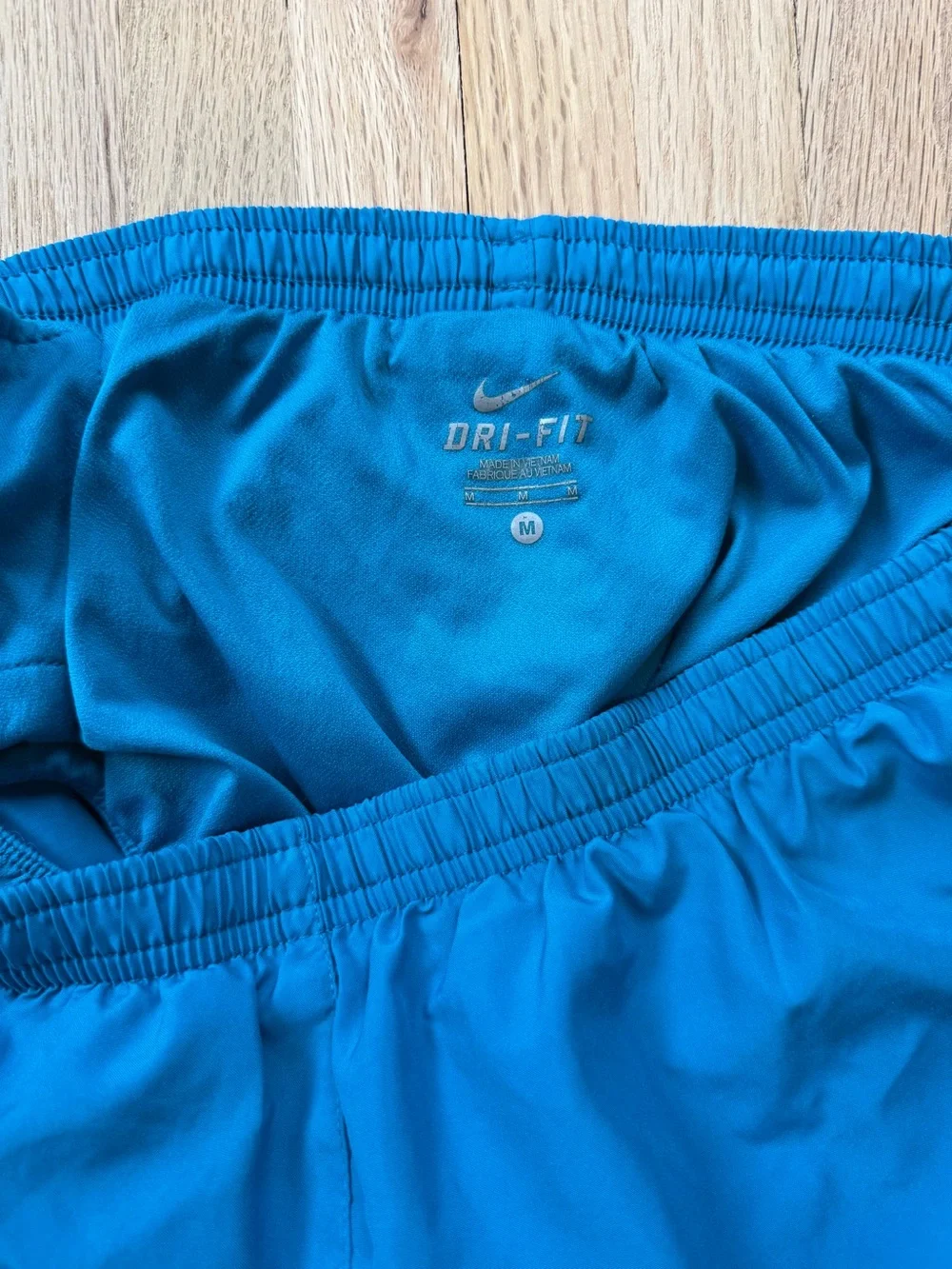 Nike Women's Teal Running Shorts with Purple Panels & Neon Yellow Trim